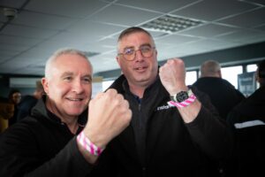 Instantor Sales Representatives showing off their team wrist bands